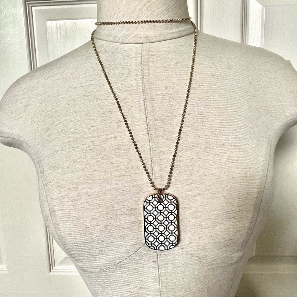 Trina Turk long gold tone dog tag necklace